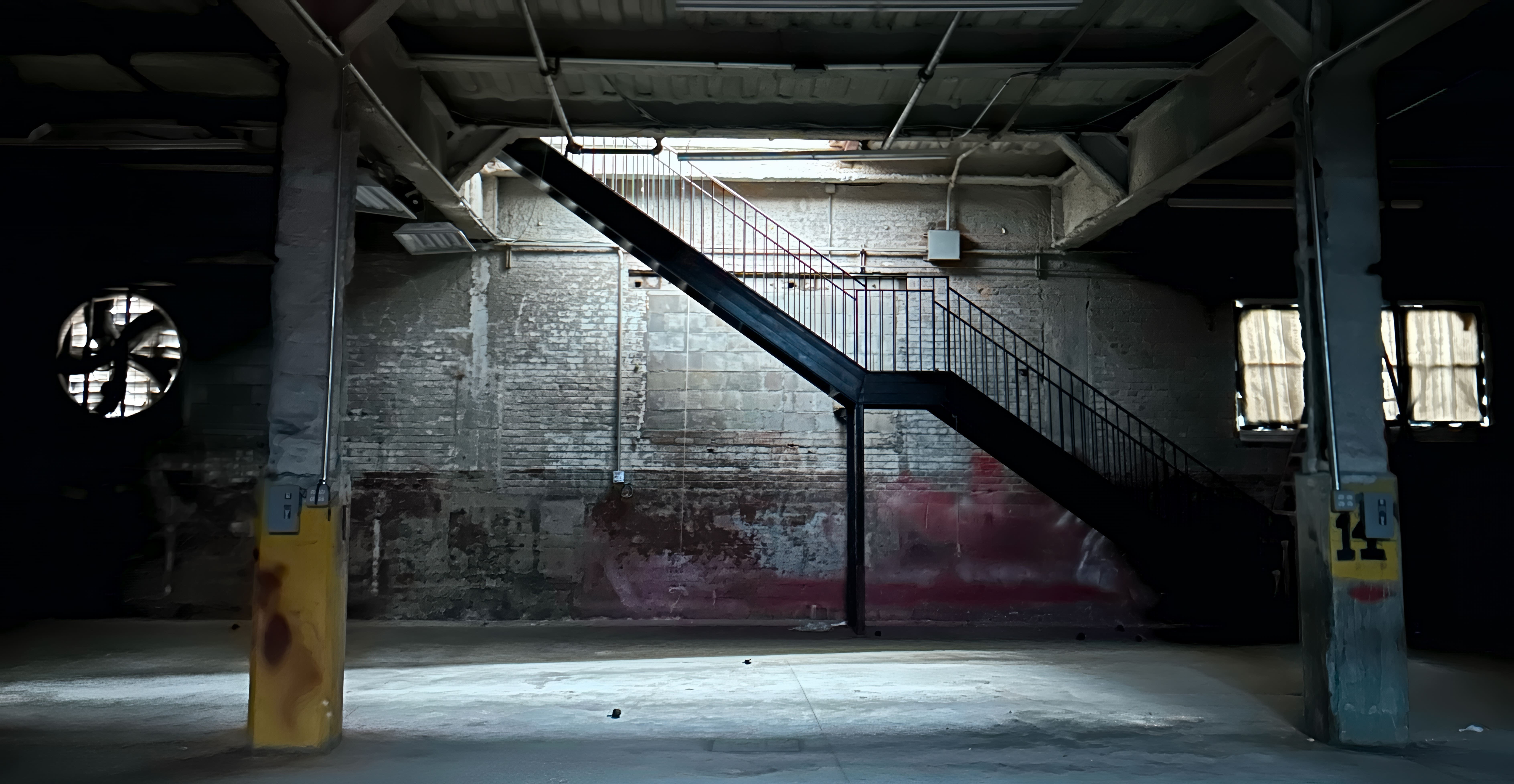 QNCC warehouse interior with industrial staircase